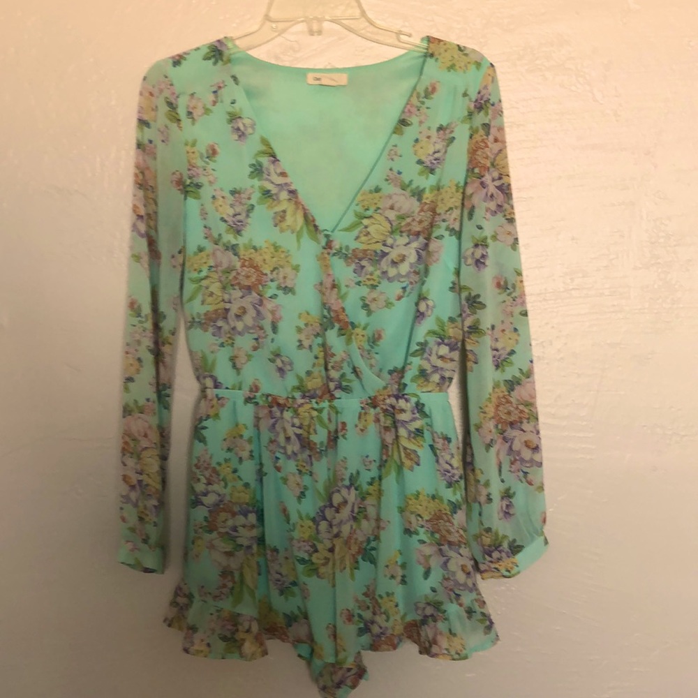 Flirty Long Sleeved Ruffled Romper.